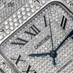 Watch dial close-up with Roman numerals, Cartier wordmark, and blue hour hand