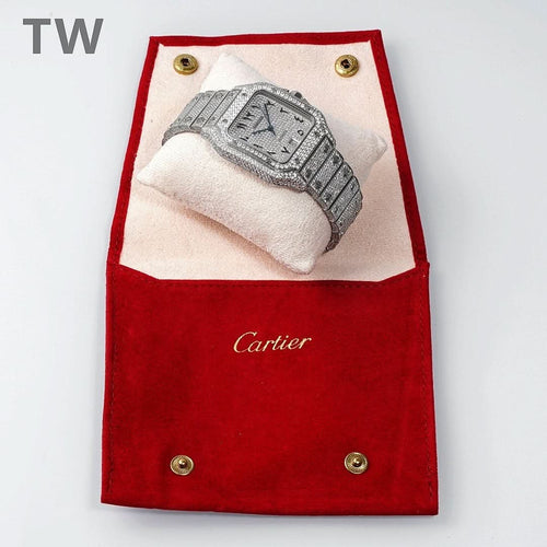 Cartier watch inside a red jewelry pouch, diamond-set bracelet visible.