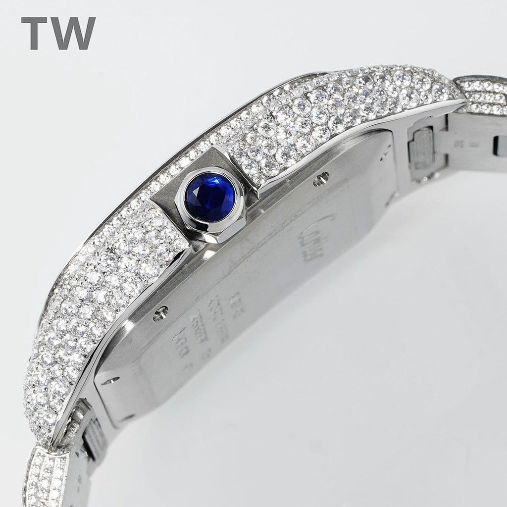 Cartier watch with blue crown setting and diamond case, close-up on side.