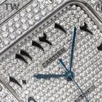 Diamond-set Cartier watch dial detail with black Arabic numerals and blue hands.