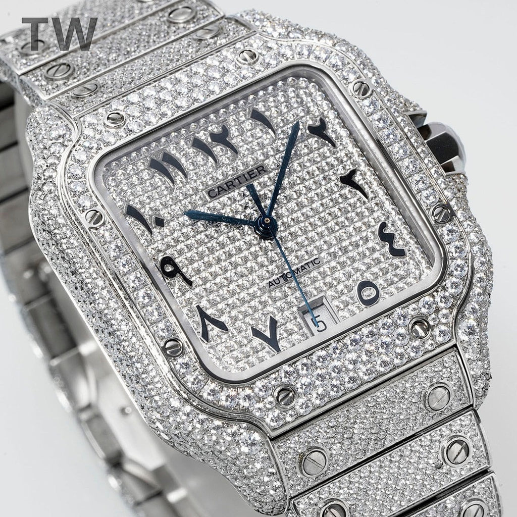 Cartier watch with diamond bezel, blue hands, black numerals, and metal link strap.
