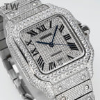 Cartier diamond-set rectangular watch face close-up with Roman numerals and blue hands