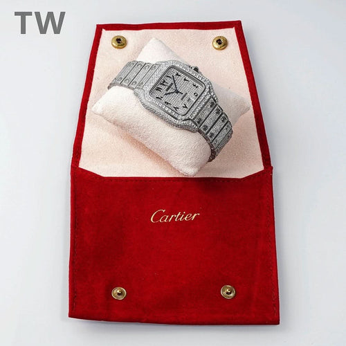 Diamond Cartier watch resting in red jewelry pouch