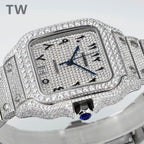 Diamond Cartier watch with blue dial, roman numerals, and bracelet links