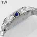 Diamond pavé wristwatch case back with blue gemstone crown