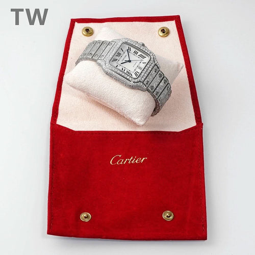 Cartier diamond wristwatch on a red presentation pouch with white cushion