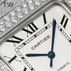 Cartier diamond wristwatch dial close-up with Roman numerals and blue hands