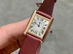 Cartier rectangular wrist watch with burgundy leather strap, gold case, white Roman dial