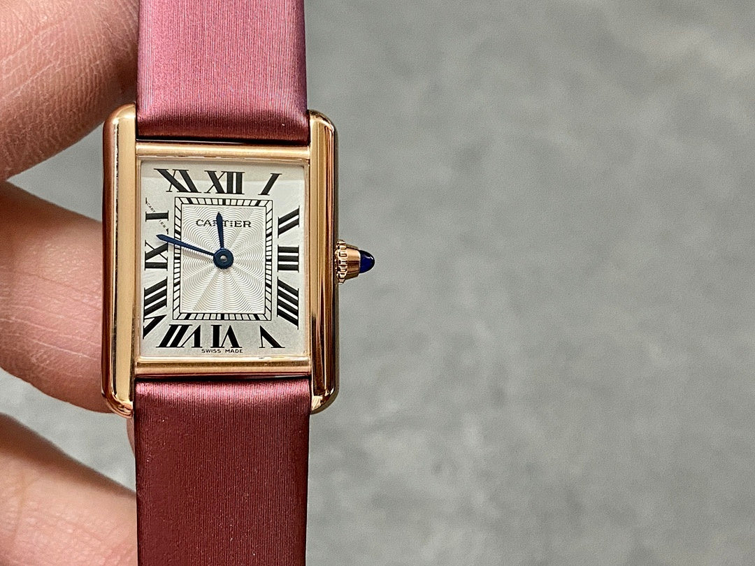 Cartier rectangular wrist watch with burgundy leather strap and gold case, Roman dial