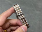 Two-tone metal watch bracelet with polished and brushed links in silver and gold tones