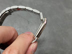 Two-tone watch bracelet underside and clasp area with polished metal links