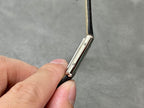 Cartier watch side profile with strap attachment and polished metal case
