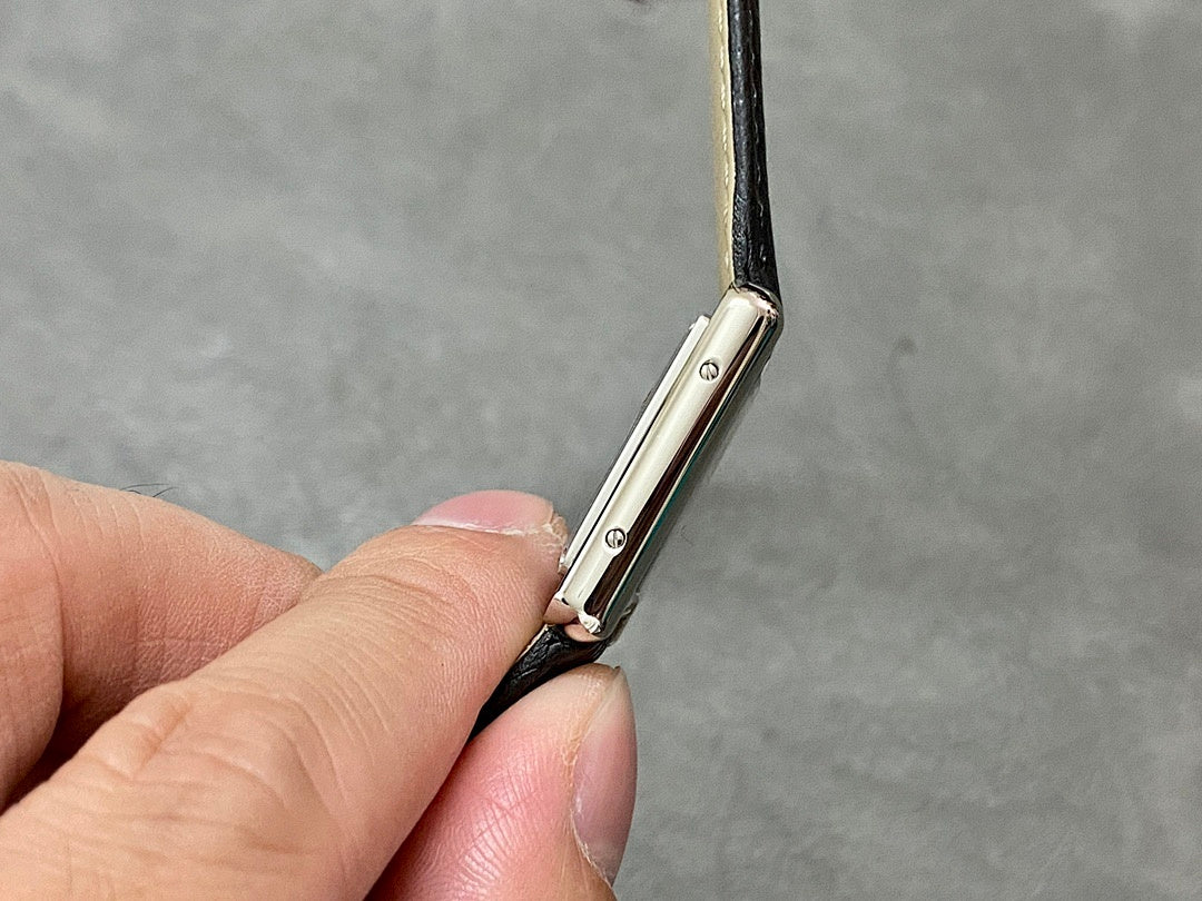 Cartier watch side profile with strap attachment and polished metal case