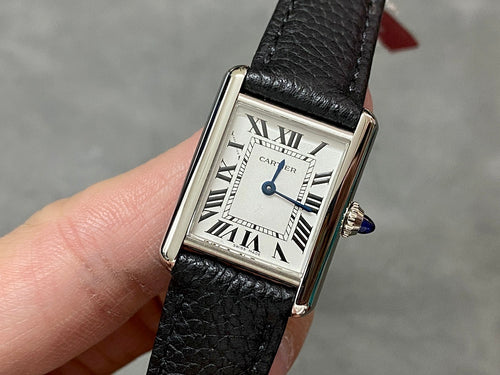 Cartier watch, square dial with Roman numerals, black leather strap, blue crown