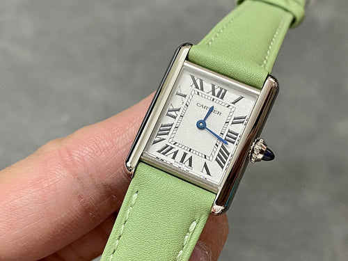 Cartier watch with green leather strap and rectangular silver dial