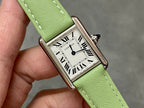 Cartier watch with green leather strap and rectangular silver dial with Roman numerals