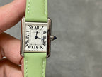 Cartier watch with green leather strap and white rectangular Roman numeral dial