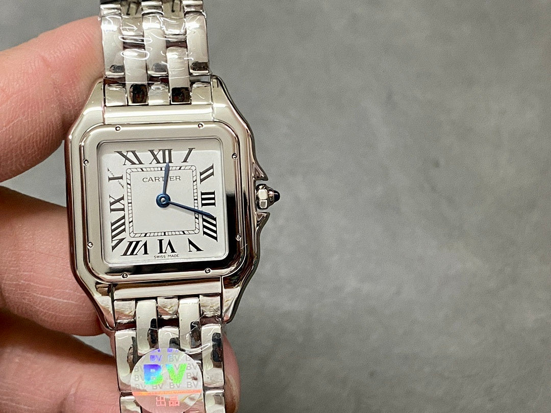 Cartier watch front with white dial, Roman numerals, and crown detail at right