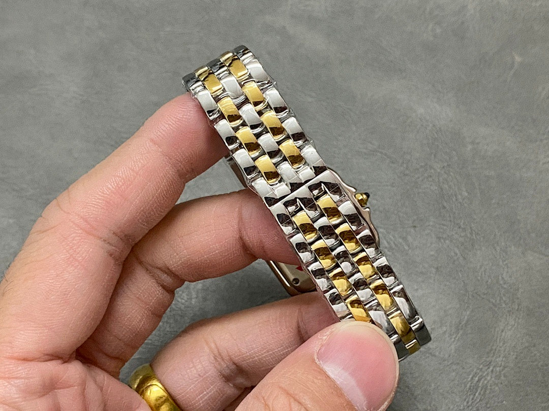 Cartier two-tone metal bracelet with alternating gold and silver links