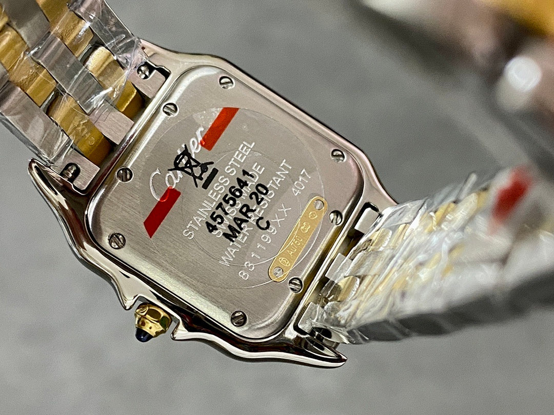 Cartier watch case back in stainless steel with markings and serial text