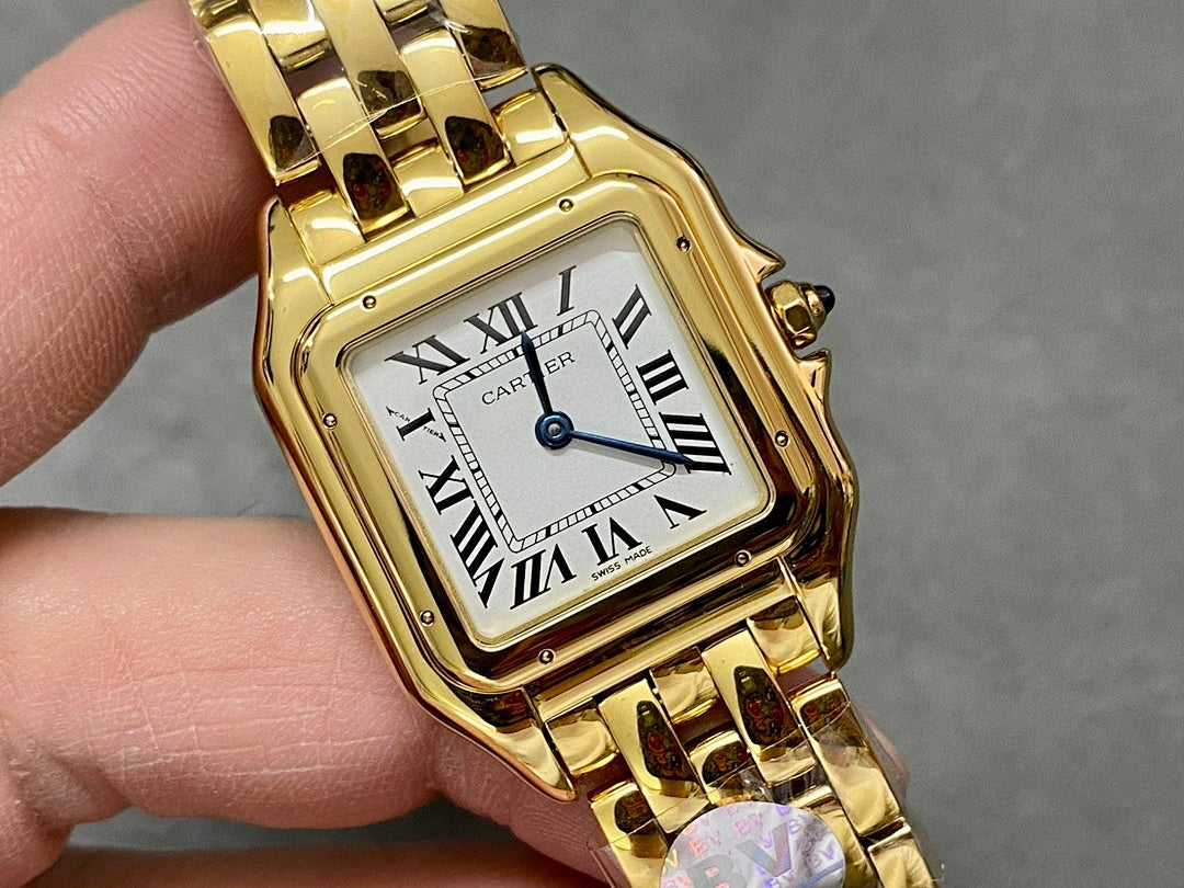 Gold Cartier watch close-up showing square dial with Roman numerals and gold case.