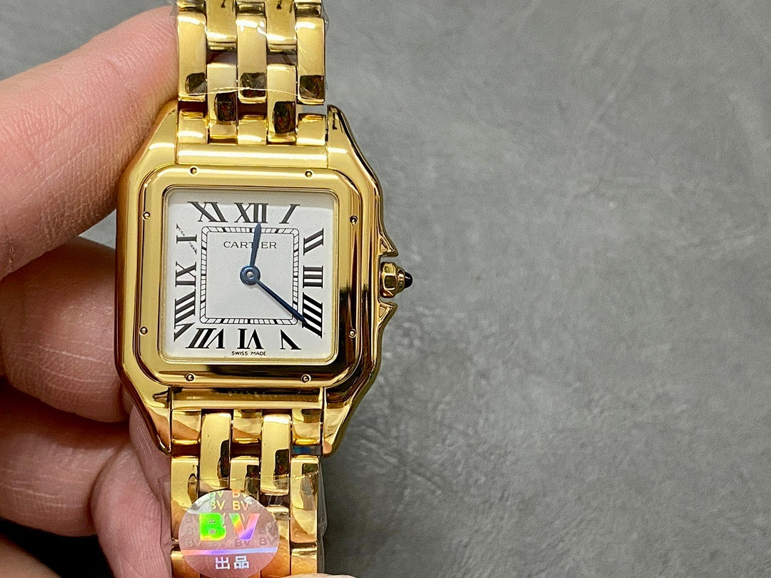 Gold Cartier watch front view with Roman numeral dial and gold link bracelet.