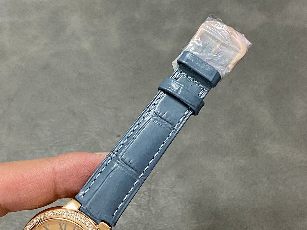Blue leather watch strap with double-layer keeper near the buckle
