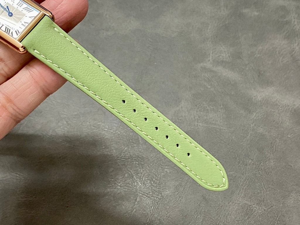 Green leather watch strap with contrast stitching and perforated end