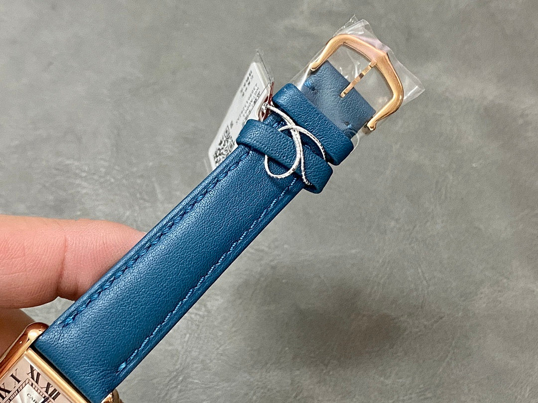 Blue leather watch strap with gold-tone buckle and rectangular clasp