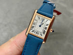 Cartier gold-tone rectangular watch, blue leather strap, white roman numeral dial