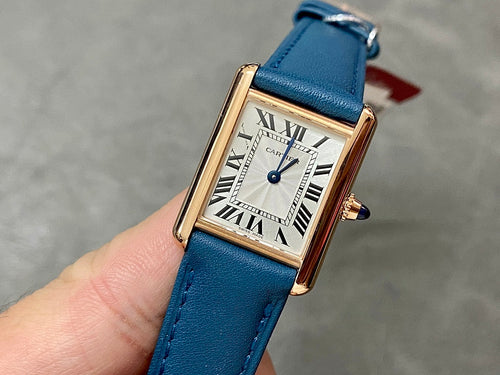Cartier gold-tone rectangular watch, blue leather strap, white roman numeral dial
