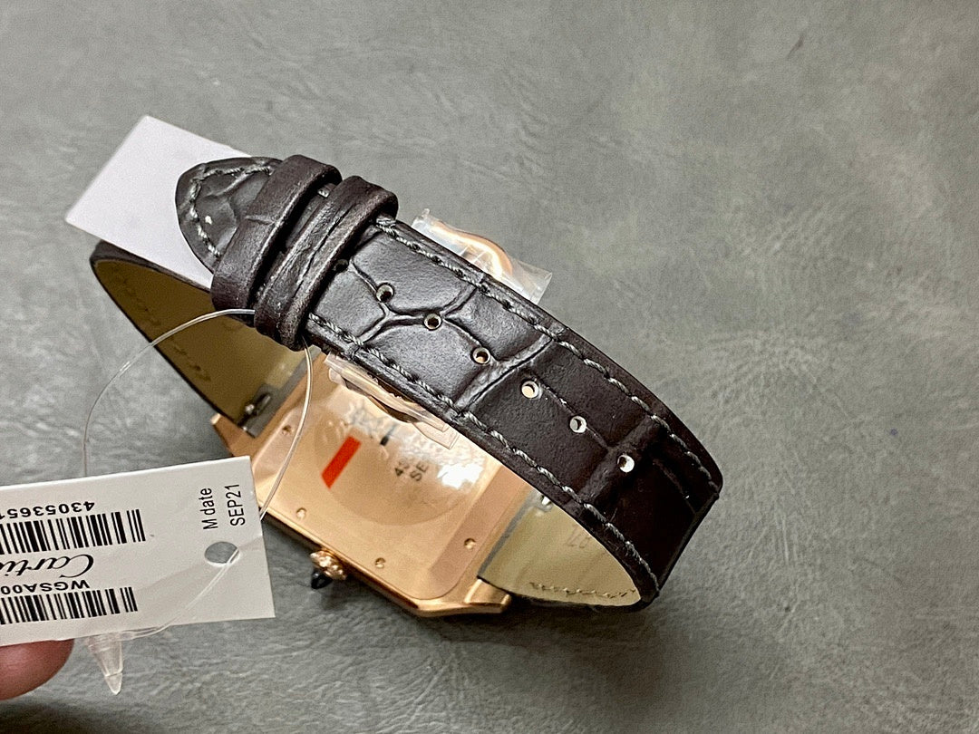 Cartier Santos watch with rose-gold case and black leather strap, underside detail.