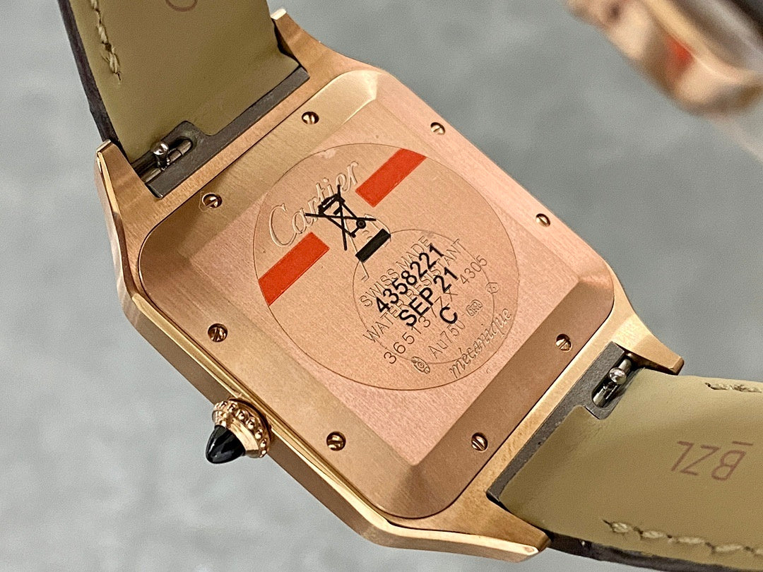Cartier Santos watch caseback with rose-gold finish and black leather strap.