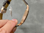 Cartier Santos watch strap clasp and back case edge with rose-gold finish.
