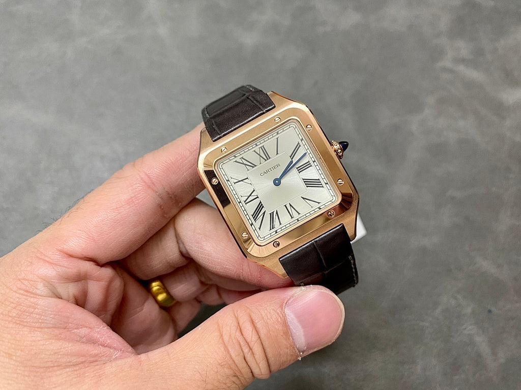 Cartier Santos watch angled front view with rose-gold case, black leather strap.