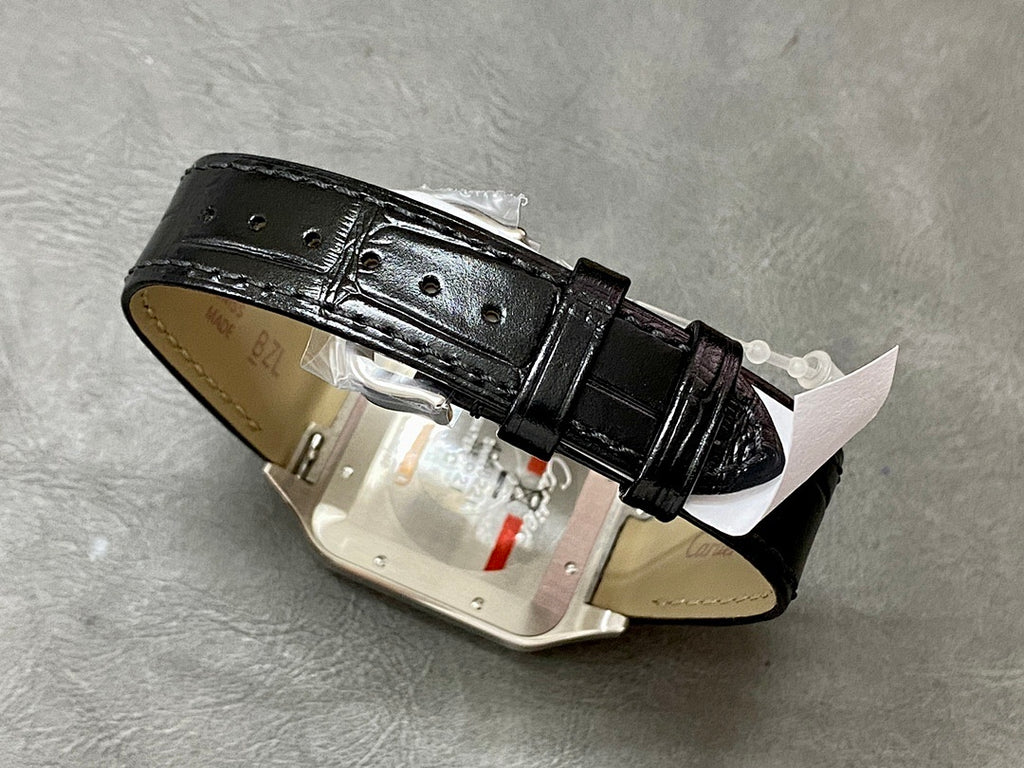 Cartier watch case underside with black leather strap and metal clasp