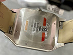 Cartier watch case back with engraved markings and leather strap edges
