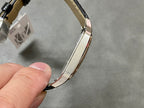 Cartier watch bracelet view with black leather strap and rose gold-tone links
