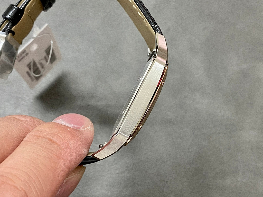 Cartier watch bracelet view with black leather strap and rose gold-tone links