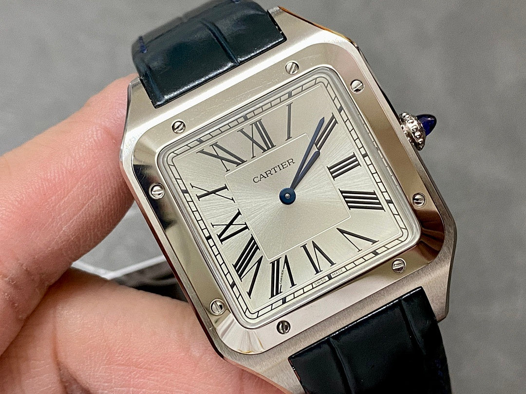 Cartier rectangular watch close-up; Roman numeral dial, black leather strap, silver case.
