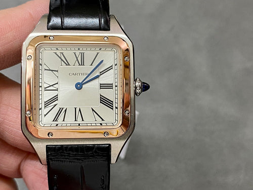 Cartier watch front view; black leather strap, Roman numerals, rose-gold tone case.