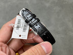 Cartier watch with black leather strap underside and case back with tag.