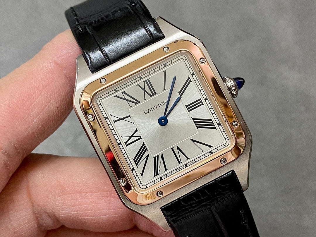 Cartier watch angled view with black leather strap and silver dial Roman numerals.