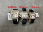 Cartier watch set of three with black leather straps and Roman numeral dials.
