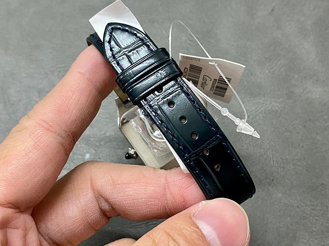 Cartier watch leather strap underside with buckle and silver-toned case back.