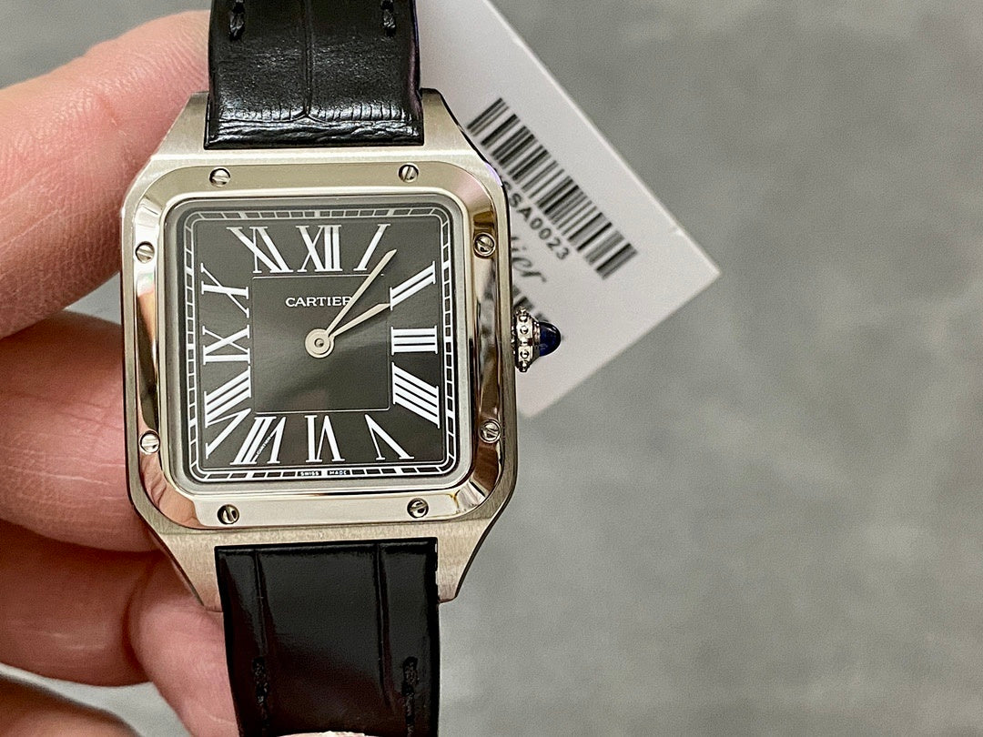 Cartier watch angled view, black leather strap and silver case with Roman numeral dial