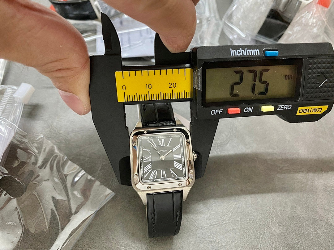 Cartier watch with black leather strap and silver case, Roman numeral dial on measuring jig