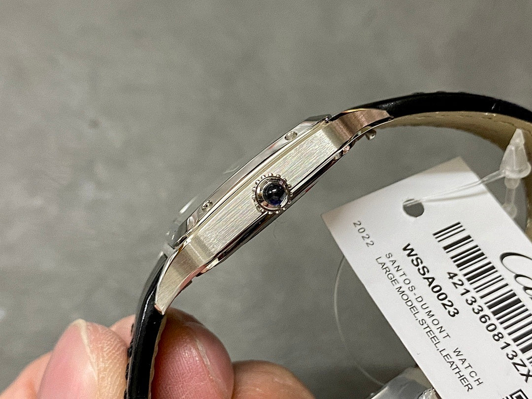 Cartier watch side profile with crown, black leather strap and silver case edge detail