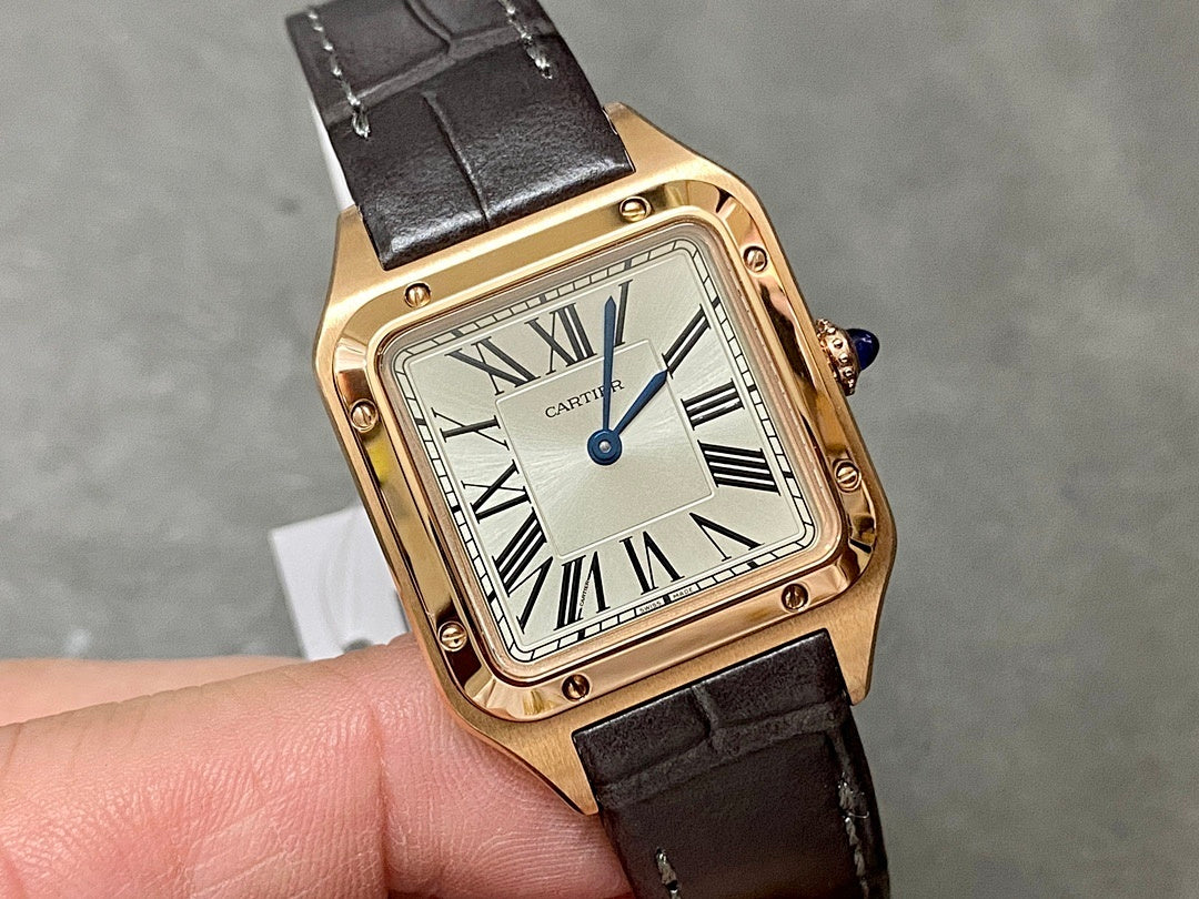Gold-tone square wristwatch with black leather strap, Roman numeral dial and blue crown.