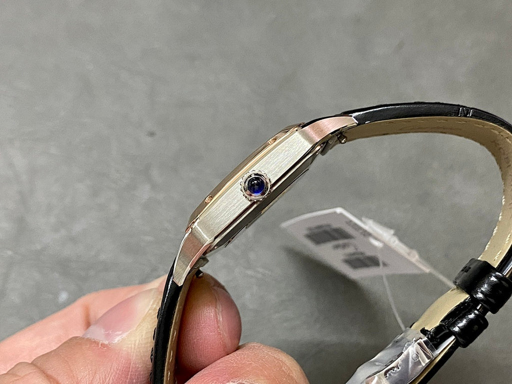 Cartier watch with rose gold-tone case and black leather strap, side profile view